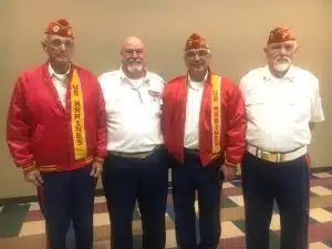 DeKalb Veterans Day Speaker Bill Rutherford with members of the 1377th Bobby Ray Detachment Marine Corps who posted colors during the program. Pictured left to right: Tom Cantrell, Bill Rutherford, Nick Emeric, and John Hummer.