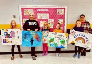 The DeKalb Prevention Coalition has recognized students who participated in a poster contest last week in support of Red Ribbon Week October 23-31. The theme for this year's Red ribbon week was “Celebrate Life, Live Drug Free” DeKalb West School winners: Pre-K to third grade pictured left to right- third place, Maggie Hendrix , (Lisa Cripps holding second place tie poster Davis Barnes) absent from picture due to field trip.), Mackenzie Brown tied for second place; First place. Claire Cripps, and the Grand prize winner! Molly McReynolds.