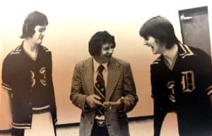 Co-Captains of 1975-76 Tiger Basketball Team Jerry Foster (left) and Al Smith (right) with their Coach Harold Luna. The team went 22-3 that season