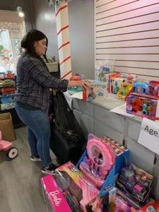 Thanks to RealSourceTitle Insurance and Real Estate Closings, through its Circle of Love project, 157 DeKalb County School aged children will have a gift this Christmas.