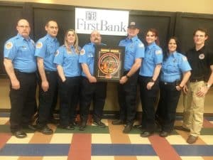 A threepeat! For the third consecutive year the Liberty Station of the DeKalb County Volunteer Fire Department has been awarded the FirstBank Station of the Year of the DeKalb County Volunteer Fire Department. Members of the Liberty Station pictured here left to right are: Equipment Officer Bill Brown, Kyle Hovey, Christina Hovey, Anthony Johnson, Station Commander Andrew Harvey, Alyssa Harvey, Kim Cantrell, and Parker Vantrease.