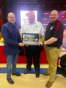 County Fire Chief Donny Green thanks Chad Colwell (left) and Alex Woodward (right) of Wilson Bank & Trust for being the headlining sponsor of the 2022 DeKalb County Fire Department’s Annual Awards Banquet held Saturday night at the county complex auditorium