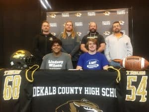 Lindsey Wilson College in Columbia, Kentucky will soon get two of DeKalb County High School Football’s finest! Seniors Shadie Rankhorn (seated left) and Ean Jones(seated right), both offensive and defensive linemen for the Tigers, signed letters of intent Friday at DCHS to join the Blue Raider program this fall. Both Rankhorn and Jones, who will be graduating from DCHS in May, were joined at the signing by DCHS Tiger Football Coaches (standing left to right: Tiger Coach Steve Trapp and Assistants Kason Wheeler, Michael Shaw, and Cole Parsley.