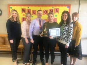 Special Education Pre-K teacher Sydney Johnson at Smithville Elementary School got a surprise visit to her classroom Tuesday for the presentation of the Smithville Elementary School Teacher of the Year Award. Making the presentation to Johnson was Director of Schools Patrick Cripps, Also on hand for the occasion were as pictured here left to right: Supervisor of Instruction Dr. Kathy Bryant, Special Education Supervisor Natasha Vaughn, Director Cripps, Ms. Johnson, Smithville Elementary School Principal Summer Cantrell and Supervisor of Instruction Michelle Burklow.