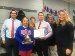 Sarah Jacobs, an 8th grade ELA teacher at DeKalb Middle School got a surprise visit to her classroom Tuesday for the presentation of the DeKalb Middle School Teacher of the Year Award. Making the presentation to Johnson was Director of Schools Patrick Cripps, Also on hand for the occasion were as pictured here left to right: DeKalb Middle School Principal Caleb Shehane, Ms. Jacobs, Supervisor of Instruction Michelle Burklow, Director Cripps, DMS Assistant Principal Angela Johnson, and Supervisor of Instruction Dr. Kathy Bryant