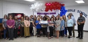 Cut the cake. It’s time to celebrate! Kudos to the students and staff at DeKalb Middle School for recent academic growth. Staff at the school recently gathered for the celebration with the cutting of a cake. ““DeKalb Middle School was named a Level 4 out of 5 school for academic growth in the 2021-22 school year measuring exceptional growth in English, math, science and social studies for grades 6-8,” said Supervisor of Instruction Dr. Kathy Bryant