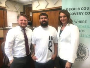 Kyle Denton (center) graduated Tuesday, May 9 from the DeKalb County Recovery Court. He was honored during a ceremony in the General Sessions Courtroom by Judge Brandon Cox (left), Recovery Court Coordinator Kate Arnold (right) and members of the DeKalb County Recovery Court Team.