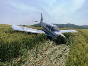 Two people escaped serious injury after their single engine plane went down Sunday afternoon in an open field near Old Temperance Hall Road in DeKalb County. (DeKalb Sheriff's Department Photo)