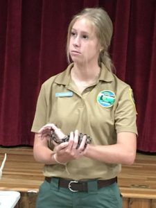 Hope Austin, seasonal assistant at Edgar Evins State Park showed off a live young python to children during Thursday’s Justin Potter and Alexandria Library Summer Reading Program event at the county complex auditorium