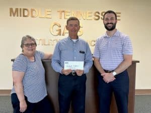 Pictured: Kim Driver Luton, Jamboree President; Mike Corley Middle Tennessee Natural Gas; Grant James, Jamboree Treasurer