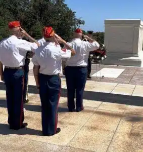 Bill Rutherford of DeKalb County, Commandant of the Marine Corps League Detachment 1377, was part of a four-man detail from that league recently invited to lay a wreath at the Tomb of the Unknown Soldier at Arlington National Cemetery in Washington DC during a special ceremony held on Saturday, September 2. Photo here shows group standing at attention and saluting after the wreath is placed