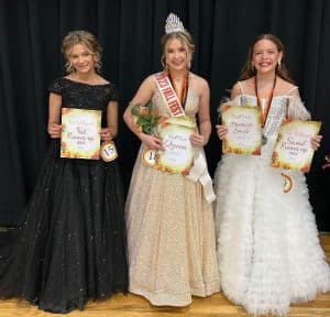Baylei Anne Benson (center)12-year-old daughter of Karey and John Washer and Christopher Benson of Smithville won the Fall Fest Queen crown of the age 11-14 category Saturday. She was also awarded for prettiest hair, attire, and most photogenic. First runner-up was Kenli Faith Fish (left), 13-year-old daughter of Tiffany Pedigo and Cody Fish of Smithville. Charley Loren Prichard (right) was second runner-up and was awarded for prettiest smile. She is the daughter of Andy and Chrissy Prichard of Liberty. 11 year old Arraya Jenae Taylor (not pictured) was judged to have the prettiest eyes. She is the daughter of Angie Taylor of Smithville. Other participants (not pictured) were 11 year old Lyra Dell McMinn, daughter of Jake and Amanda Franklin; and Mila Goff, 11 year old daughter of James and Krista Goff of Smithville.