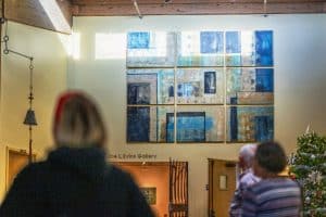 Visitors at Tech's Appalachian Center for Craft gaze at the newly-dedicated painting titled "Reminiscences" by the late Sally Crain-Jager.