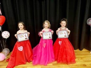 Valentine Pageant Saturday: Optional winners in the 4-6 year old category: Blakely Faith Moore of Smithville (left), 4-year-old daughter of Scotty and Emily Moore was judged to have the prettiest smile. Annabelle Bowen of Liberty (pictured center), 4-year-old daughter of Jacob and Kayla Bowen received the prettiest eyes award, and Elizabeth Mary Sue Gammons of Smithville (right) was awarded for prettiest hair and for being Most Photogenic. Gammons is the 5-year-old daughter of Amanda Ford.