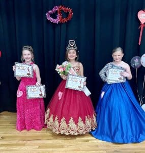 Valentine Pageant Saturday: Capturing the crown in the 7–9-year-old division was Rosellen Arleth Garrido of Smithville (pictured center). She is the 7-year-old daughter of Lorena Juarez and Enrique Garrido. Rosellen is a 2nd grader at Smithville Elementary School. Runners-up in this category were 1st- Stella Grace Adcock of Smithville (right), 9-year-old daughter of Byron and Paige Adcock; and 2nd- Alexis Shepherd of Dowelltown (left), 9-year-old daughter of Donald and Misty Shepherd. Alexis Shepherd was also awarded for prettiest smile and Stella Adcock received the award for prettiest eyes, hair, and attire