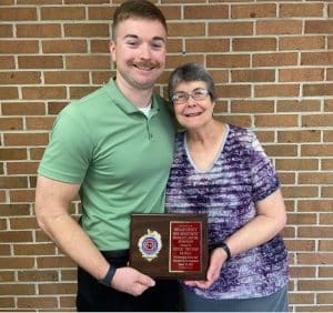 Clyde Thomas Family Receives Honorary Lifetime Membership from DeKalb Fire Department: Pictured are Lieutenant Luke Green and Jan Thomas, representative of the Clyde Thomas Family.