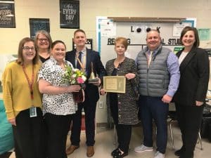 Northside Elementary Teacher Kathy Ramsey Named 2024 DeKalb School District Teacher of the Year. Ramsey got a surprise visit to her classroom Tuesday for the “John Isabell Memorial Award” presentation by Director of Schools Patrick Cripps, Northside Elementary School Principal Angela Johnson, NES Assistant Principal Beth Pafford, Supervisors of Instruction Michelle Burklow and Randy Jennings, and Federal Programs Supervisor Dr. Danielle Collins. As part of the honor, Ramsey also received a school bell award, a floral arrangement, and a certificate granting her a day off from school with pay.