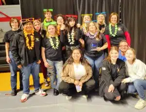 D.C.H.S. Winter Guard Performs at Championships: Kneeling front row - Alumni - Yoana Hernandez-Avalos, Hannah Finan, Hannah Swoape, Eli Martin (not pictured alumni Olivia Diego) 2nd row (left to right) - Bairon Hernandez-Avalos, Crissy White, Elizabeth Cardin, Ashton McClain 2rd row (left to right) - Kim Whitt (Band Director Don Whitt's wife), Jamey Bradshaw, Jay Bare, Kara Inglis, Hadley Vergeson, Lake Moser (manager) and Shannon Johns (Instructor)