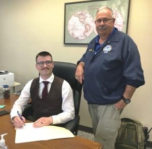 County Mayor Matt Adcock signs proclamation recognizing May 19-25 as Emergency Medical Services Week. Pictured here with DeKalb EMS Director Hoyte Hale