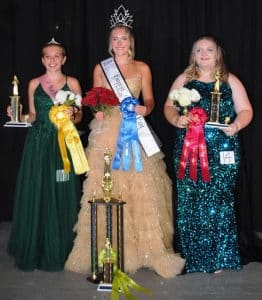 18-year-old Allyson Roxanne Fuller is the 2024 DeKalb County Fairest of the Fair. She was crowned queen Monday evening on opening night of the 2024 DeKalb County Fair. Fuller is the daughter of Anthony and Amanda Fuller of Smithville. She succeeds the retiring queen Kenlee Renae Taylor, the 19 year old daughter of Ken and Cindy Taylor of Smithville. Fuller was also named Miss Congeniality of the pageant. First runner-up in the Fairest of the Fair event was Jasmen Faith Chapman of Smithville (pictured right), 17 year old daughter of Debbie Miller and Jamie Chapman. Second runner-up was Shaelee Foster (pictured left), 17 year old daughter of Margie and Doyne Glass of Sparta. She was also judged Most Photogenic