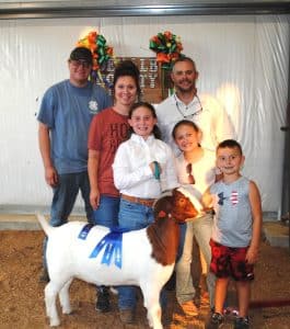 Andrea Kate Estes of Smithville was a big winner in the Junior Goat Show at the DeKalb County Fair Thursday evening. Estes won for Junior Showmanship and the Doe Kid Division as well as the Overall Doe Kid and Yearling Doe Grand Championship. Andrea is pictured here with her family and winning Doe Kid entry: (Left to right) Carl Paris, Emily Estes, Andrea Estes, Andy Estes, Caroline Estes and Sterling Estes