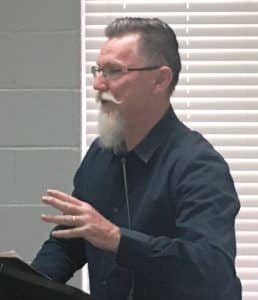 Walnut Street Merchants Seeking Solutions to Keep Jamboree Craft Vendors from Blocking Access to Their Storefronts. Randy Caldwell of the Purple Door Antiques and Unique’s on West Walnut Street, shown here addressing the mayor and aldermen Monday night