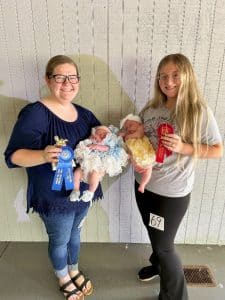 DeKalb Fair Baby Show: Girls (1 day to 3 months) Winner: Charlotte Cay Koelle (pictured left), one month old daughter of Heather and Christian Koelle of Smithville; Runner-up: Hennessee Bailiff (pictured right), one month old daughter of Jordon and Briella Bailiff of Liberty