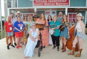 Keeping the embers glowing! Continuing a tradition started several years ago honoring an individual performer or group each year for helping keep the embers of bluegrass music glowing for future generations, the Smithville Fiddlers Jamboree Saturday evening presented the 2024 “Blue Blaze Award” to Sister Sadie right after this talented and popular all-female band put on an exciting mini concert which left the crowd wanting more.