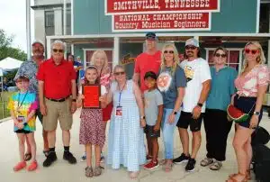 Family members of the late James G. “Bobo” Driver presented the Beginner Fiddling Championship Award to the 2024 winner Ella Derby of Franklin. The award is named in memory of Mr. Driver who started the children’s competition at the Fiddlers Jamboree some 40 years ago.