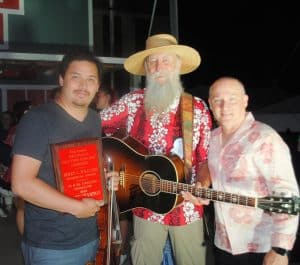 Tyler Andal’s big weekend! The Nashville fiddler (pictured left) took home a total of seven awards from the 53rd annual Smithville Fiddlers Jamboree and Crafts Festival over the weekend including the biggest prize, the Berry C. Williams Memorial for claiming the Grand Champion Fiddling Title. As the 2024 Grand Fiddle Off Champion, Andal will be invited by the Grand Ole Opry to play a ‘fiddle tune’ for the Opry square dancers’ LIVE performance during a selected show . Darrin Vincent, member of the Grand Ole Opry’s award-winning Dailey & Vincent group (pictured far right), presented the award to Andal at the conclusion of the festival which ended at 11 p.m. Saturday night. Also pictured is Rob Pearcy of Smyrna (center) who accompanied Andal on guitar during his winning performance