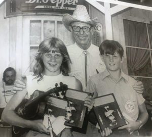 Sister Sadie band member Deanie Richardson competed at the Fiddler’s Jamboree as a child and was one of the first winners in the Jamboree’s National Championship for Country Musician Beginners in the 1980s.. She is pictured here with Jamboree founder James G. "Bobo" Driver and another beginner contestant