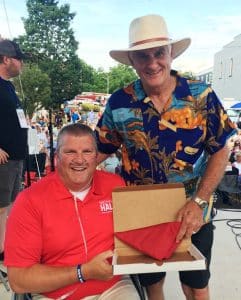 State Representative Michael Hale presented a flag to Roger Wolfe of Memphis at the Fiddlers Jamboree Friday night