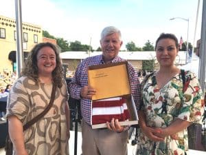 Congressman John Rose’s Chief of Staff Van Hilleary presented a US flag flown over the capitol to Katie Rowe (left) and Amina Deiab (right) of Emonton Alberta Canada at the Fiddlers Jamboree Friday night.