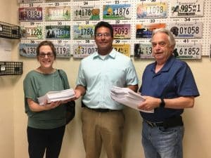 County Commissioner Beth Pafford and Dennis Stanley, volunteers of a petition drive, Thursday afternoon turned over to County Clerk James L. (Jimmy) Poss, as required by law, names of 2,471 presumptive registered voters who have signed that they want a public referendum on whether the county should issue general obligation bonds ( borrow) up to $65 million for the development and construction of a judicial center/jail