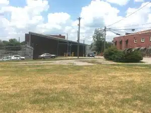 Photo shows eastside view of the DeKalb County Jail Annex from South 1st Street. The county owns a portion but not all of the property shown from this view