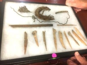 Display of Native American tools, dart, string, and heel of a moccasin, etc. to be shown during Native American Artifacts Show Saturday, July 27 at County Complex starting at 8 a.m.