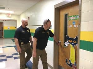 Sergeant Will Judkins of the Smithville Police Department (left) and Detective Chris Russell of the DeKalb County Sheriff’s Department (right)were among local officers roaming the halls checking interior doors Monday at Northside and Smithville Elementary Schools during school lock down intruder drills