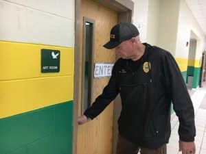 Smithville Police Chief Mark Collins checking doors at Northside Elementary School during lock down intruder drilll Monday