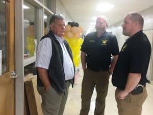 Special Agent Jimmy Puckett of the Tennessee Department of Safety Homeland Security (left) with Chief Deputy Brian Williams (center) and Detective Stephen Barrett of the DeKalb County Sheriff’s Department (right) shown in the halls of Smithville Elementary School during a lock-down intruder drill Monday