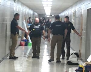 Smithville Police and DeKalb County Sheriff’s Department officers shown in the halls of Smithville Elementary School during a lock-down intruder drill Monday