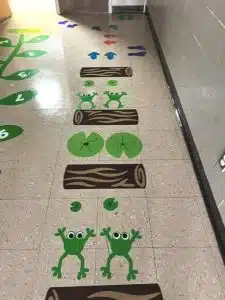 Smithville Elementary School has developed a new sensory hallway at the school especially for students perhaps experiencing dysregulated behavior and emotional regulation. The hallway floor features markings for activities like hopscotch with unique names for each section like Sunny Valley, Lava Leaps and Dinosaur Cove.