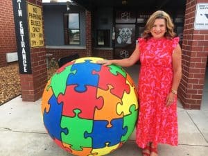 Smithville Elementary School has undergone a few cosmetic changes. Principal Anita Puckett (shown here) said visitors to the school will notice new signage, window clings, a sensory hallway for students, and the sphere bollards out front of the building which were recently given a new colorful look. The work was done over the summer.