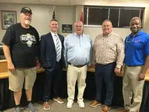 One of the most successful high school coaches ever at DeKalb County High School is being recognized with an honor for all time. During Thursday night’s regular monthly meeting, the Board of Education voted to name the DCHS baseball field for former coach Joey Reeder, who guided the Tiger baseball program for 16 seasons from 1982 to 1997. He is pictured here with a few of his former players left to right DCHS Principal Bruce Curtis, Director of Schools Patrick Cripps, Joey Reeder (now School District Attendance Supervisor, Supervisor of Instruction for grades 6-12 Randy Jennings, and Board of Education Chairman Shaun Tubbs.