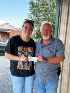 Danny Pirtle of the Scottish Rite Chapter of DeKalb County presents $1000 scholarship award to Ms. Abby Cross of Dowelltown.