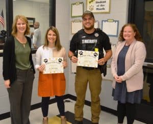 Standing left to right are Principal Sabrina Farler, September Teacher of the Month Cathleen Humphrey, September Employee of the Month SRO Billy Tiner and Assistant Principal Cindy Snow.