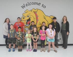 August Students of the Month: Standing first row left to right are Dyllan Bates, Kendyl Parker, Blakely Dodd, Neyland Garrett, Maddux Ellis, and Annalyn Garrett. Second row left to right are Assistant Principal Cindy Snow, Zane Griffith, Karlee Pierce, Kayla Hamlett, Slade Bennett, and Principal Sabrina Farler.