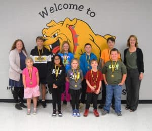 September Students of the Month: Standing front row left to right are Zariyah Waller, Leyla Garza, Remi Scott, Maddix Meyers, and Knox Bowen. Back row left to right are Assistant Principal Cindy Snow, Gabe Blair, Aniston Cox, Colton Saso-Varble, John Michael Byrd, and Principal Sabrina Farler.