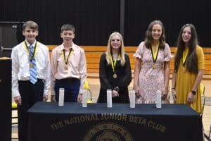 New DWS Junior Beta Club officers standing left to right are Gabe Blair, Kaden Mullinax, Mia Hall, Kate Pistole, and Kaylee Womack.