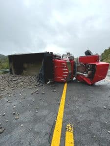 A truck driver for the Luke Prichard Excavating and Trucking Company, 57-year-old Terry L. Bullard escaped injury Monday morning when the dump truck he was driving loaded with rock overturned on Highway 70 at Snow Hill. No other vehicles were involved. The crash was investigated by the Tennessee Highway Patrol. Photo by Jim Beshearse