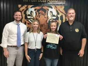 The September Student of the Month award at DeKalb County High School goes to Jessa Sanders, a 9th grader. Pictured left to right are DCHS Assistant Principals Seth Willoughby and Jenny Norris, Student of the Month Jessa Sanders and DCHS Principal Bruce Curtis